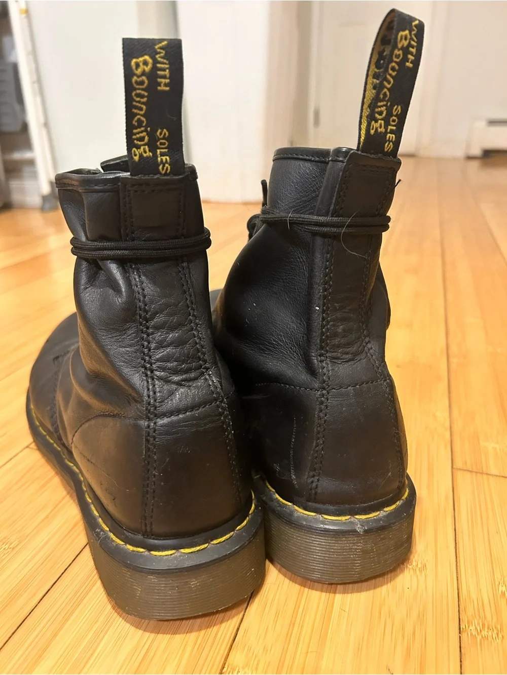 Dr. Martens Black Leather 8-Eye Lace-Up Boots with Yellow Stitching